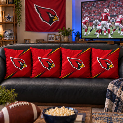 Four matching Arizona Cardinals throw pillows styled on a living room sofa