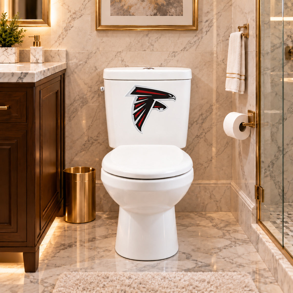Atlanta Falcons decorative sticker on a white toilet tank in a marble bathroom