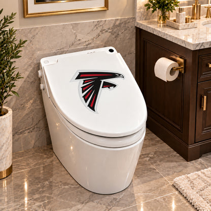 Atlanta Falcons decorative sticker on a closed white toilet lid in a marble bathroom