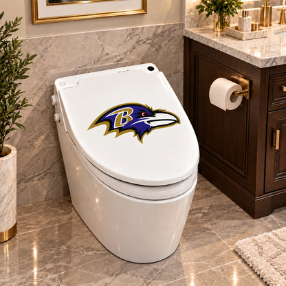 Baltimore Ravens decorative sticker on a closed white toilet lid in a marble bathroom