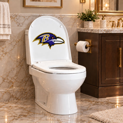 Baltimore Ravens decorative sticker on the inside of a white toilet lid in a marble bathroom