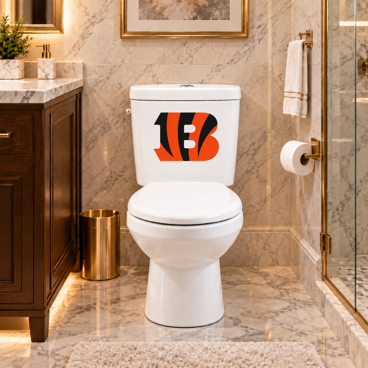 Cincinnati Bengals decorative sticker on a white toilet tank in a marble bathroom