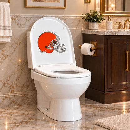 Cleveland Browns decorative sticker on the inside of a white toilet lid in a marble bathroom