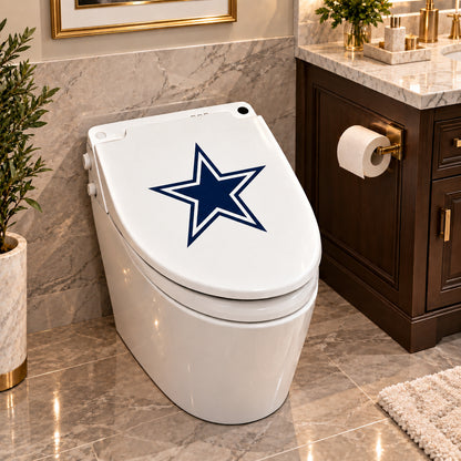 Dallas Cowboys decorative sticker on a closed white toilet lid in a marble bathroom