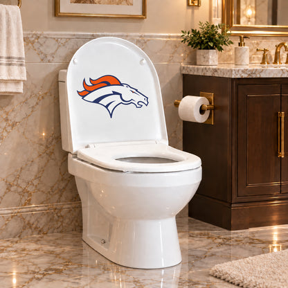 Denver Broncos decorative sticker on the inside of a white toilet lid in a marble bathroom
