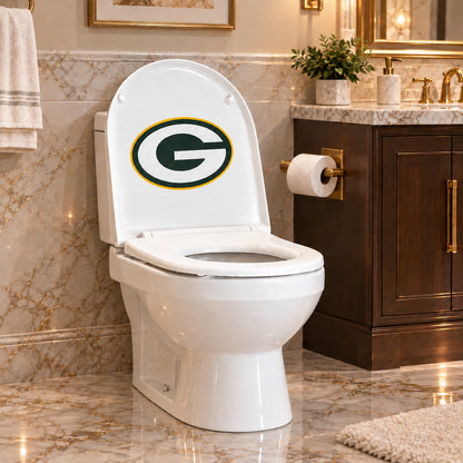 Green Bay Packers decorative sticker on the inside of a white toilet lid in a marble bathroom