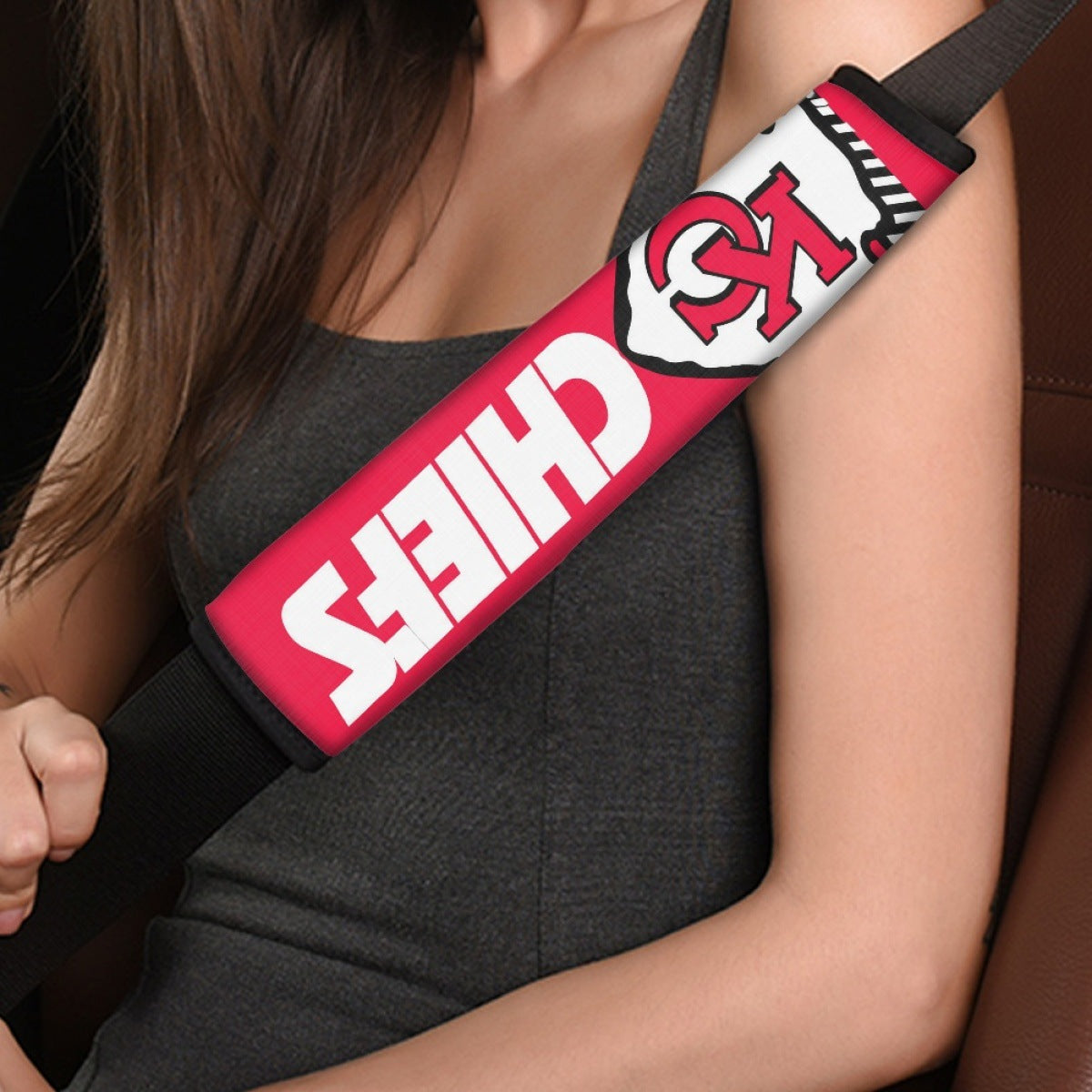 Close-up of Kansas City Chiefs shoulder strap cover worn on a car seat belt