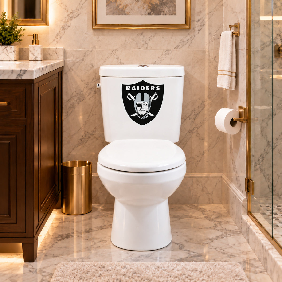 Las Vegas Raiders decorative sticker on a white toilet tank in a marble bathroom