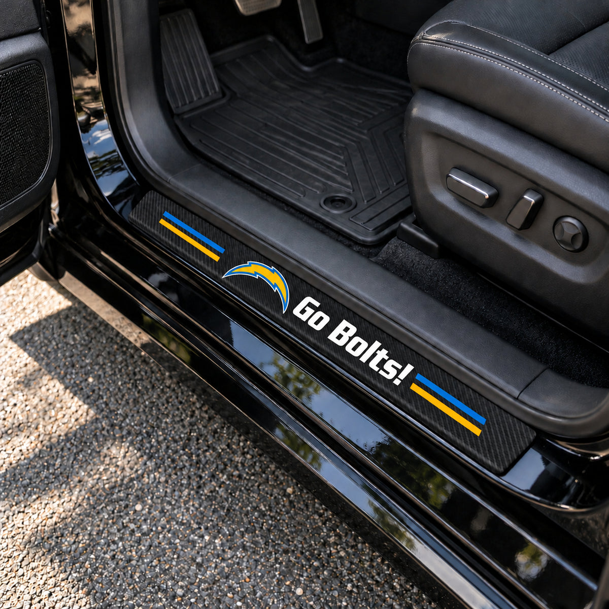 Los Angeles Chargers carbon fiber texture car door sill protector strips installed on a black car