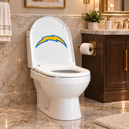 Los Angeles Chargers decorative sticker on the inside of a white toilet lid in a marble bathroom