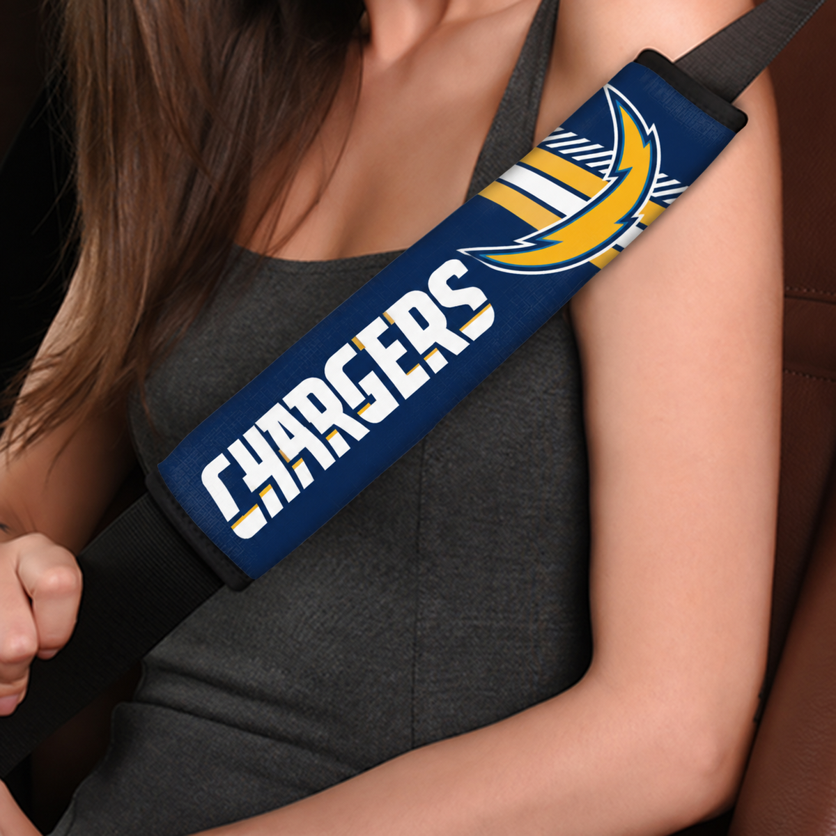 Close-up of Los Angeles Chargers shoulder strap cover worn on a car seat belt