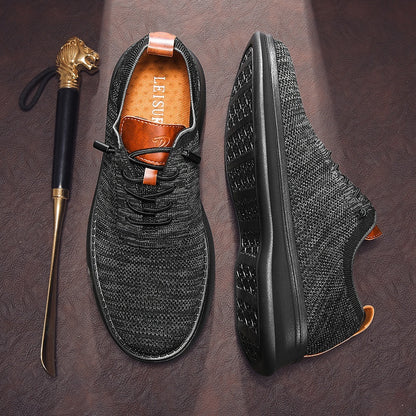Men's breathable knit dress sneakers, black upper with black sole, top and outsole view