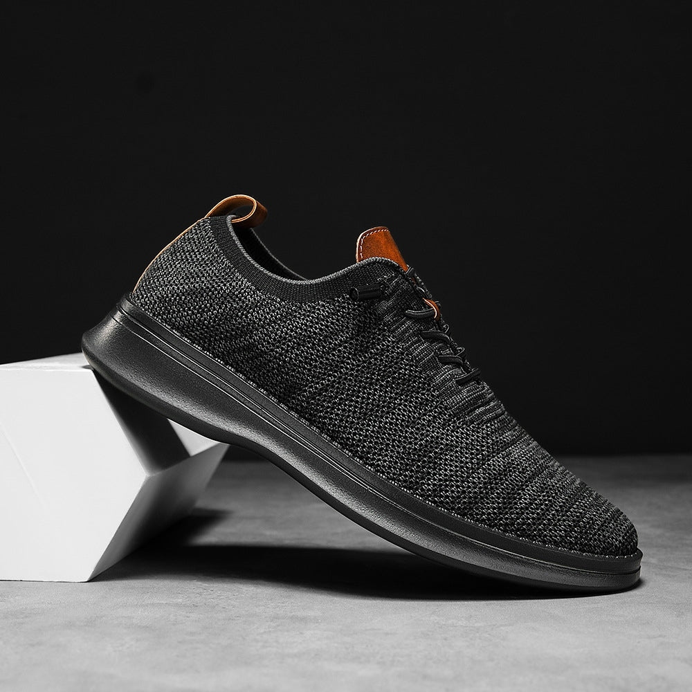 Men's breathable knit dress sneakers, black upper with black sole, side view