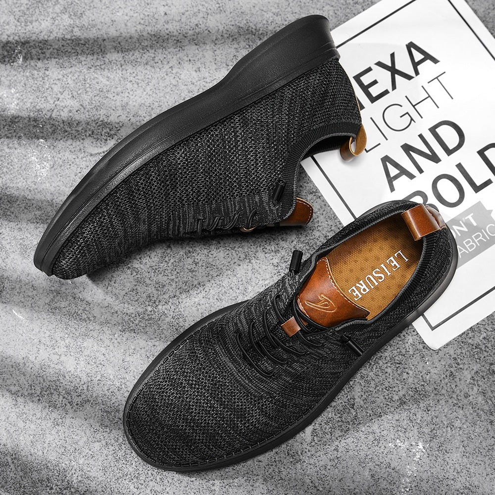 Men's breathable knit dress sneakers, black upper with black sole, top pair view