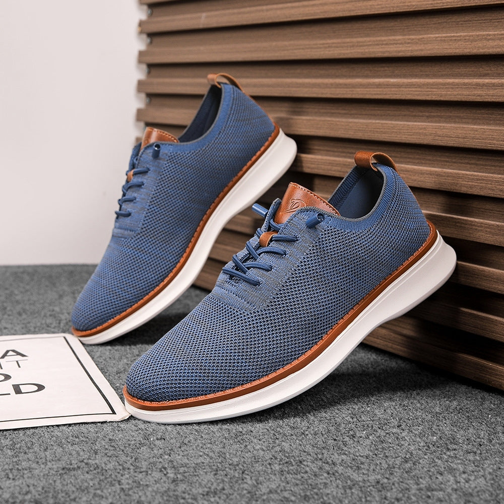 Men's breathable knit dress sneakers, blue upper with white sole, angled pair view