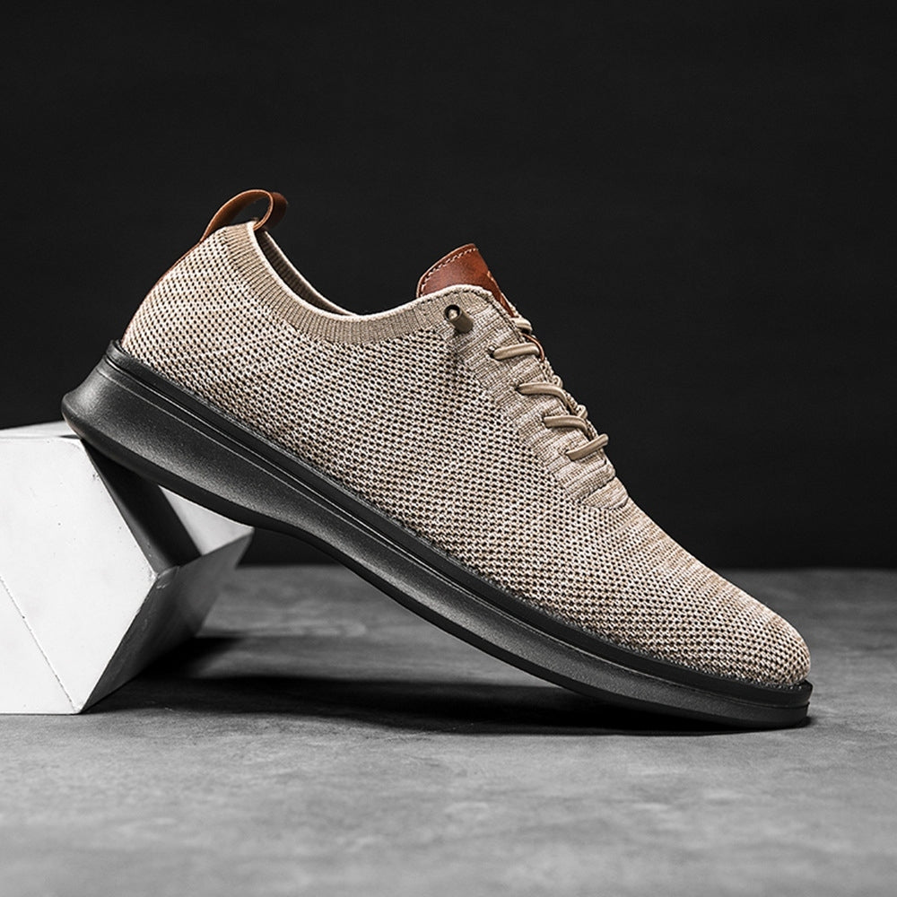 Men's breathable knit dress sneakers, cream upper with black sole, side view