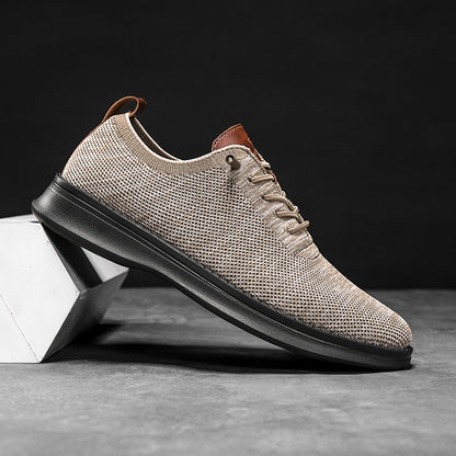 Men's breathable knit dress sneakers, cream upper with black sole, side view