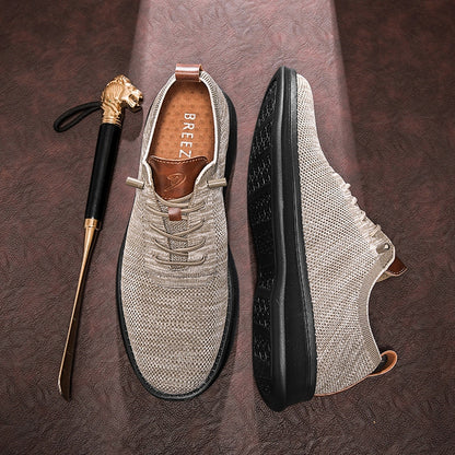 Men's breathable knit dress sneakers, cream upper with black sole, top and outsole view