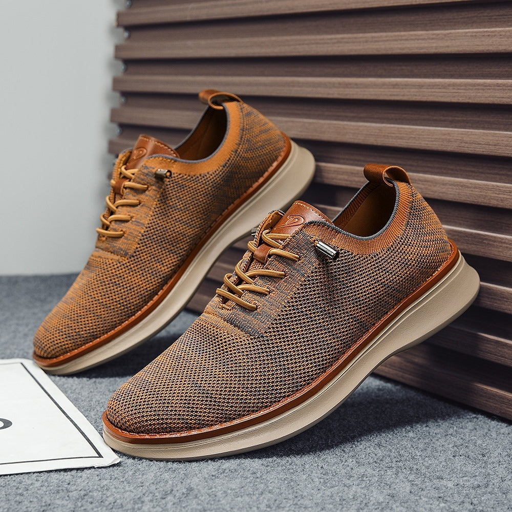 Men's breathable knit dress sneakers, orange upper with beige sole, angled pair view