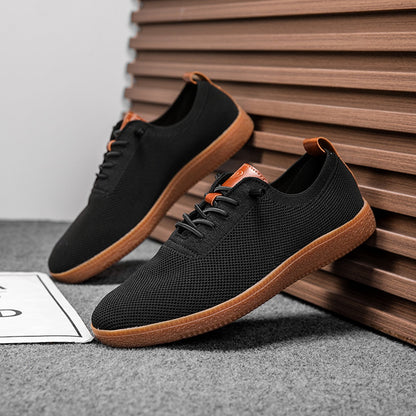 Pair of men's black breathable knit gum-sole sneakers