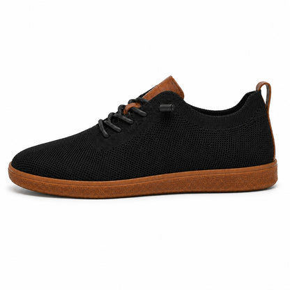 Men's black breathable knit slip-on sneaker on white background