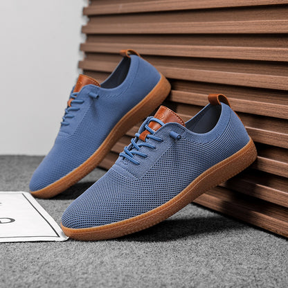 Pair of men's blue breathable knit gum-sole sneakers