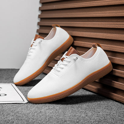 Pair of men's white breathable knit gum-sole sneakers