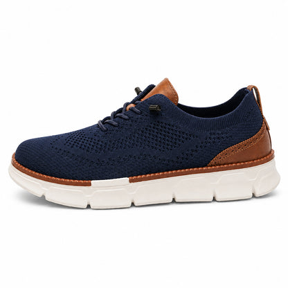 Navy men's breathable stretch-knit slip-on walking shoe side view on white