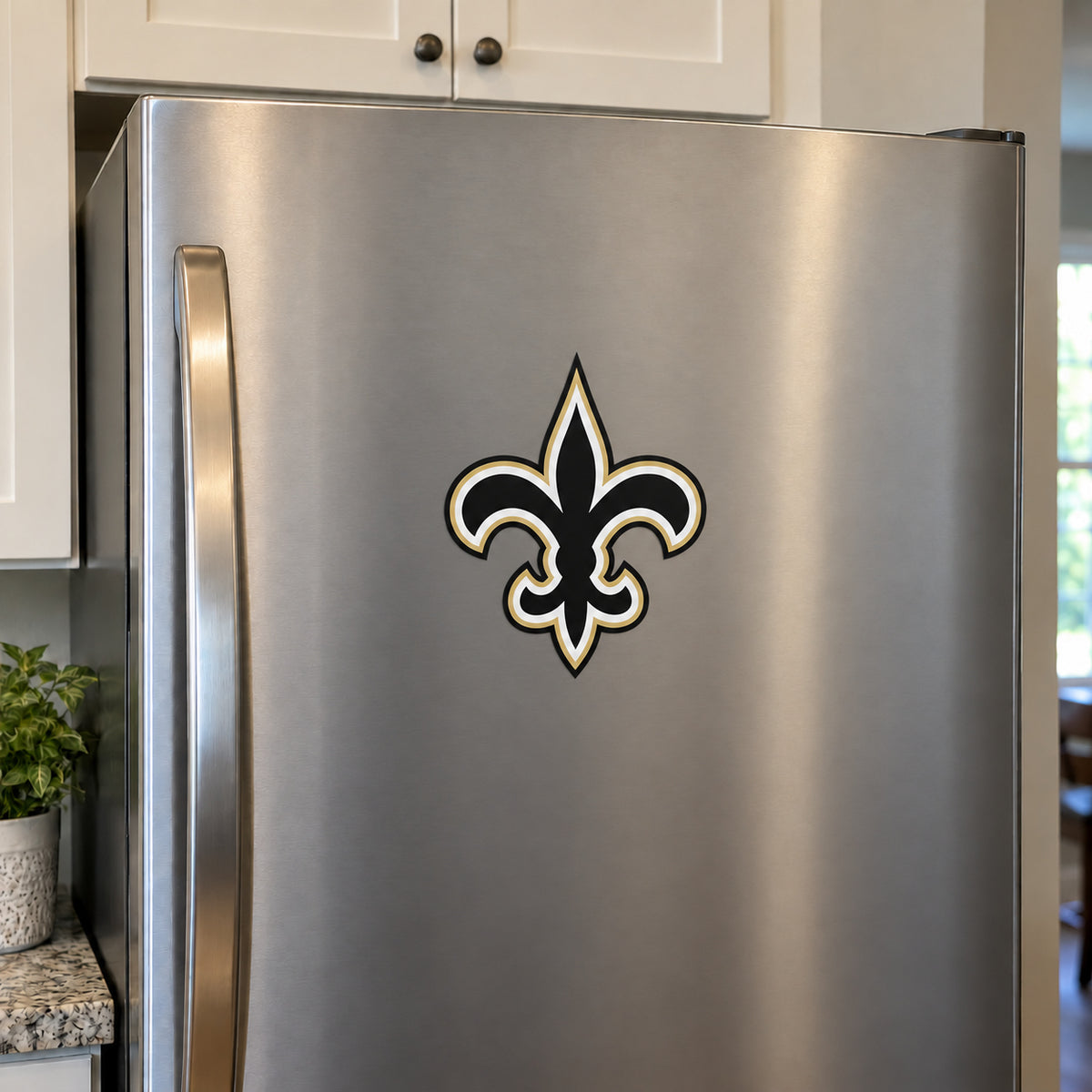 New Orleans Saints decorative sticker displayed on a stainless-steel refrigerator