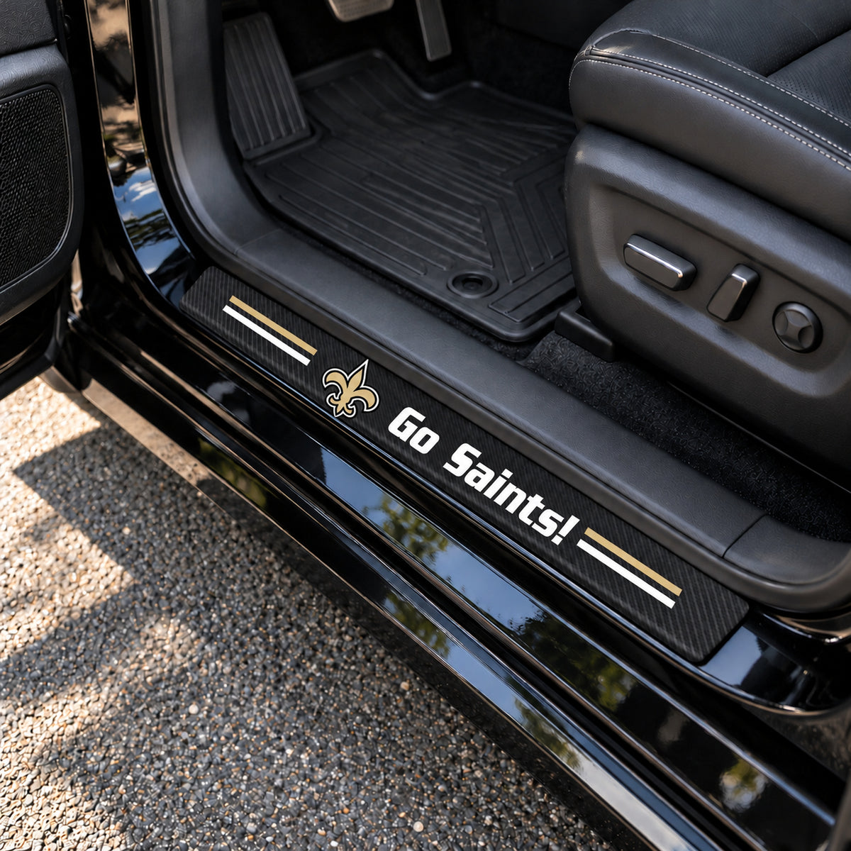 New Orleans Saints carbon fiber texture car door sill protector strips installed on a black car