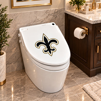 New Orleans Saints decorative sticker on a closed white toilet lid in a marble bathroom