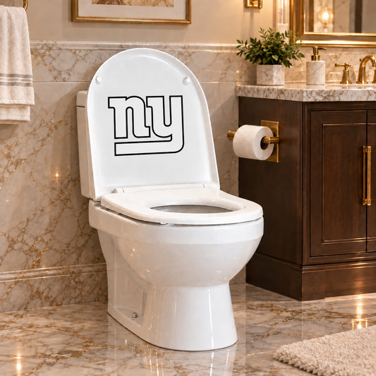 New York Giants decorative sticker on the inside of a white toilet lid in a marble bathroom