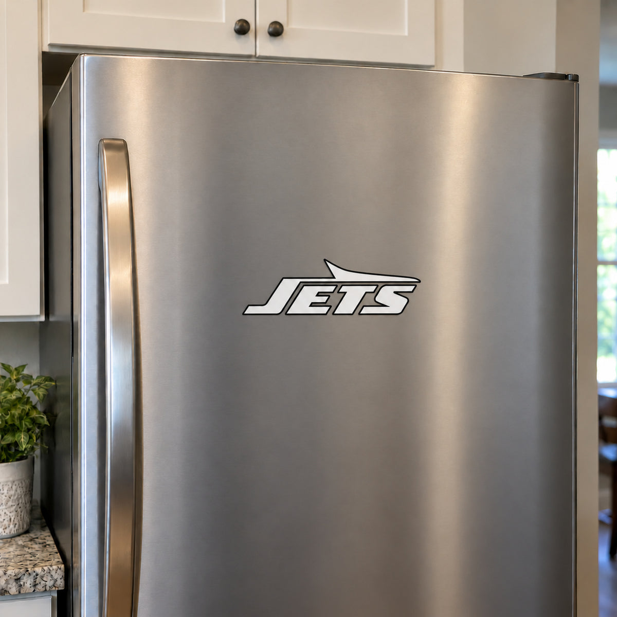 New York Jets decorative sticker displayed on a stainless-steel refrigerator