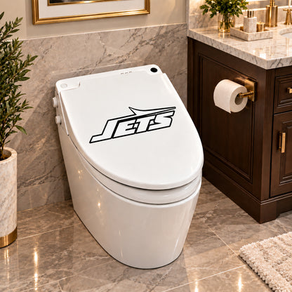 New York Jets decorative sticker on a closed white toilet lid in a marble bathroom