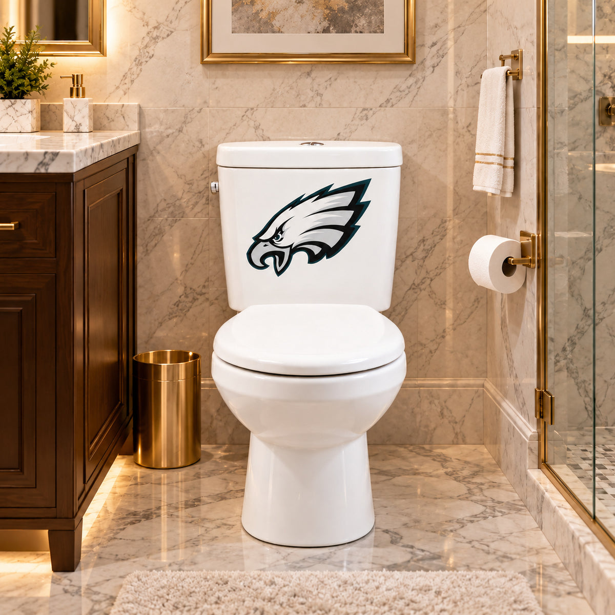 Philadelphia Eagles decorative sticker on a white toilet tank in a marble bathroom