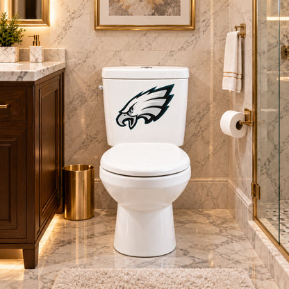 Philadelphia Eagles decorative sticker on a white toilet tank in a marble bathroom