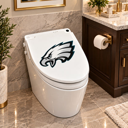 Philadelphia Eagles decorative sticker on a closed white toilet lid in a marble bathroom