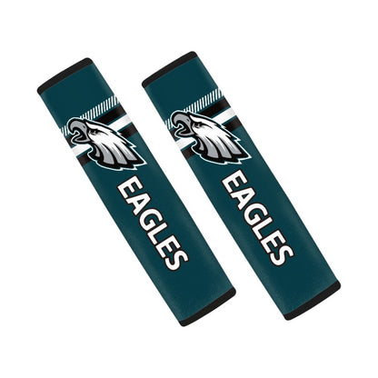 Pair of Philadelphia Eagles seat belt and backpack shoulder strap covers on a white background