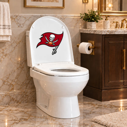 Tampa Bay Buccaneers decorative sticker on the inside of a white toilet lid in a marble bathroom