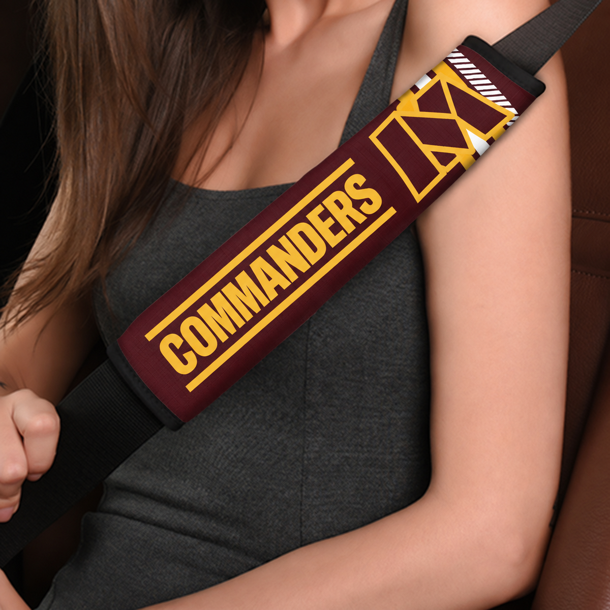 Close-up of Washington Commanders shoulder strap cover worn on a car seat belt